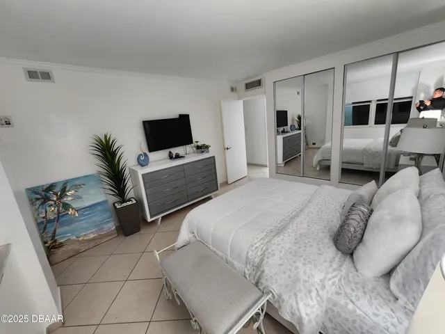 a bathroom with a double vanity sink toilet and shower