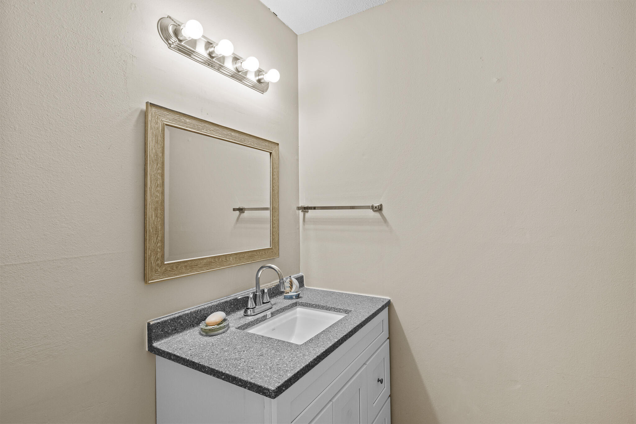 8 Hidden Cove Circle Valparaiso, FL 32580 - Photo 4 of 23 a bathroom with a granite countertop sink and a mirror