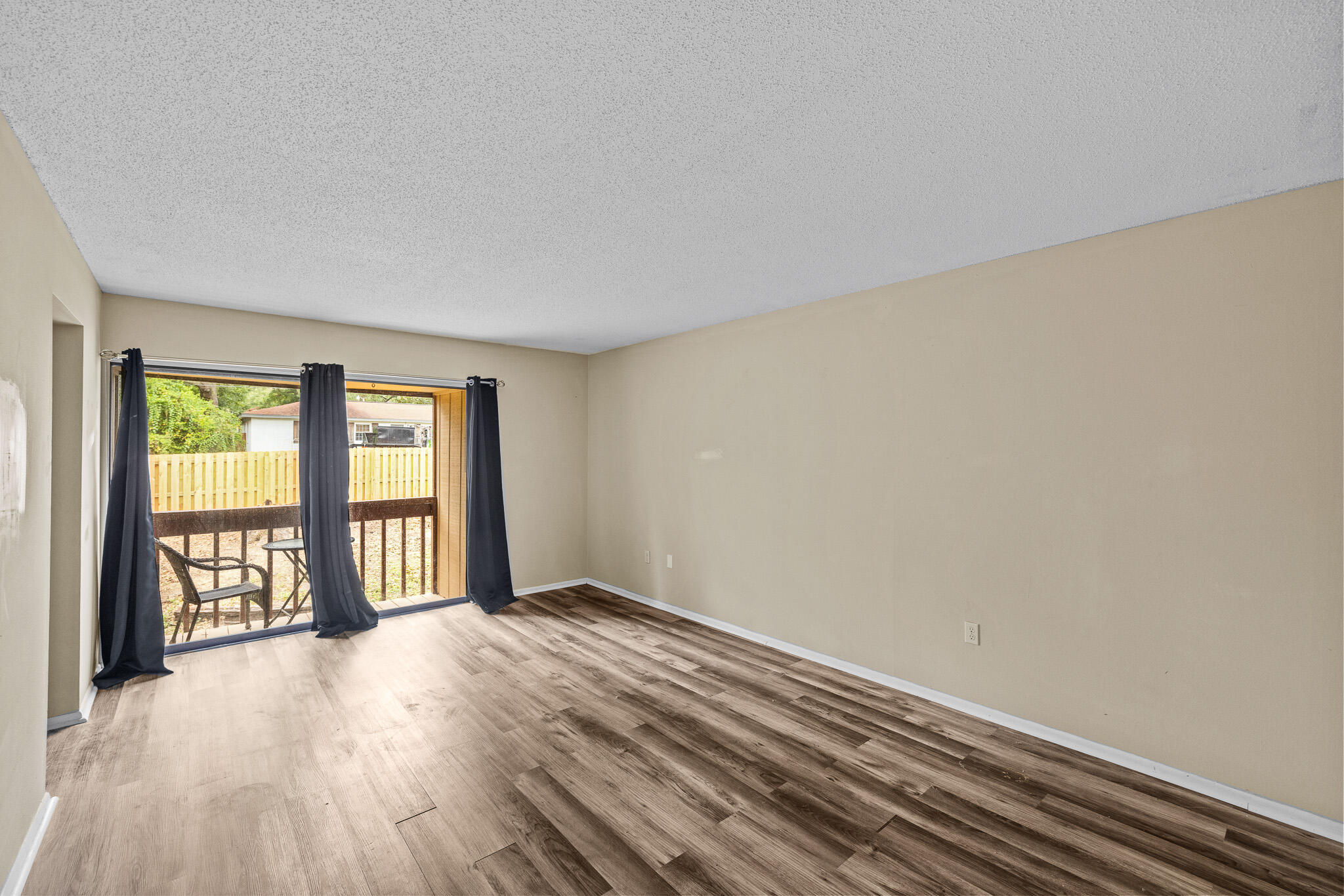 8 Hidden Cove Circle Valparaiso, FL 32580 - Photo 10 of 23 a view of an empty room with glass door