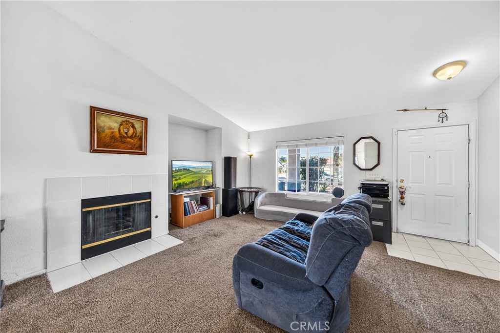 2995 Joshua Way Hemet, CA 92545 - Photo 14 of 34 a living room with furniture a fireplace and a flat screen tv