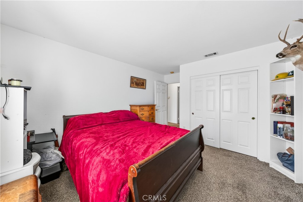 2995 Joshua Way Hemet, CA 92545 - Photo 30 of 34 a bedroom with a bed and a closet
