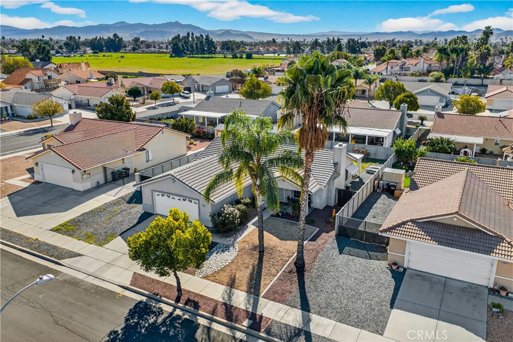 2995 Joshua Way Hemet, CA 92545 - Photo 3 of 34 an aerial view of residential houses with outdoor space and swimming pool