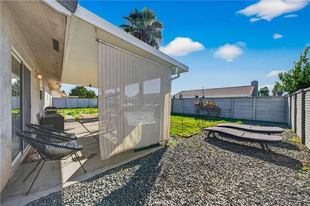 2995 Joshua Way Hemet, CA 92545 - Photo 32 of 34 a wooden bench sitting in front of a building