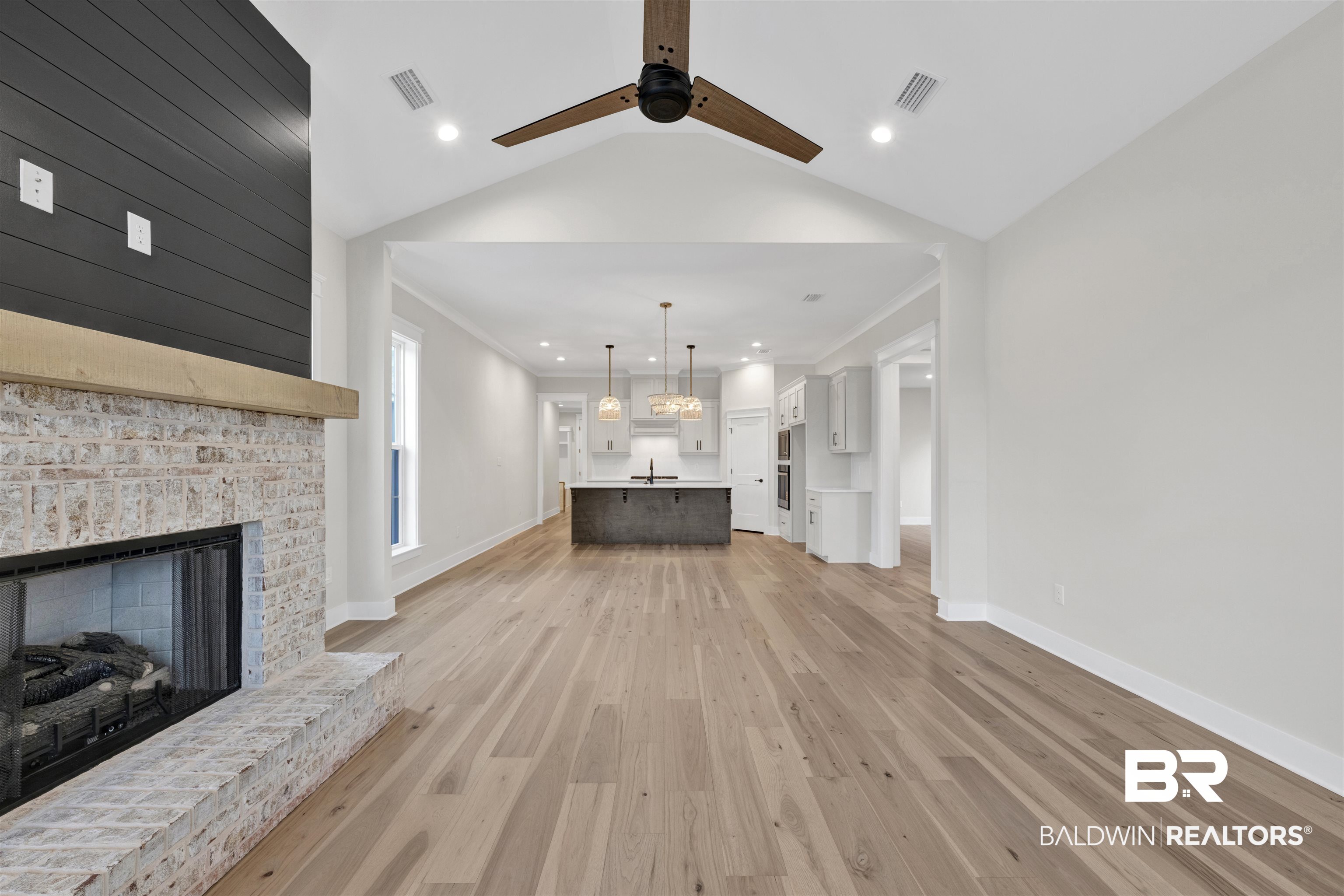 27382 Patch Pl Loop Daphne, AL 36526 - Photo 7 of 31 Unfurnished living room with light wood-style flooring, a fireplace, ceiling fan, crown molding, and recessed lighting