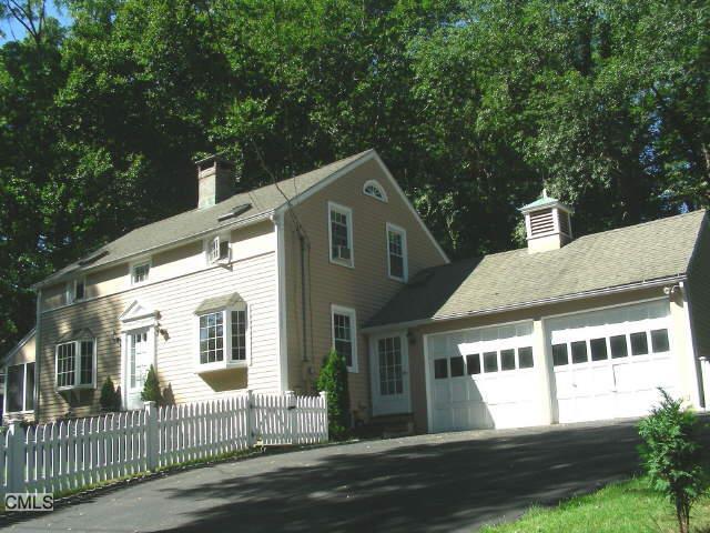 845 Bronson Road Fairfield, CT 06824 - Photo 1 of 1 a front view of a house with a yard