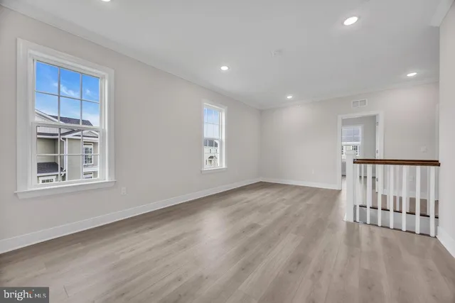 a view of livingroom with hardwood floor and hallway