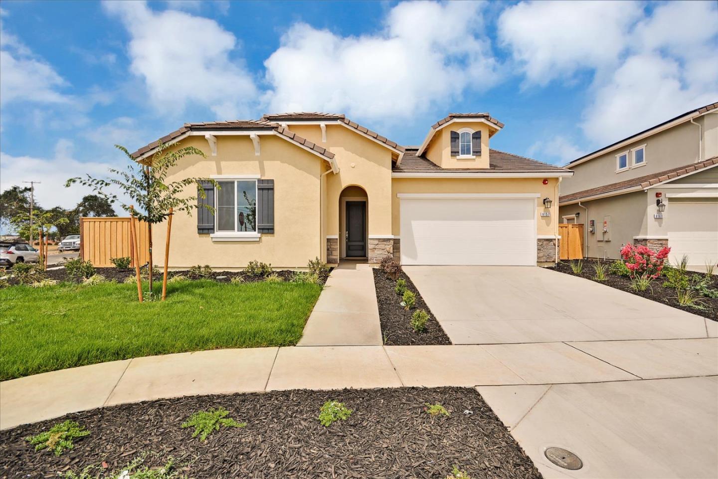 8157 Poppy Ridge Road Elk Grove, CA 95757 - Photo 1 of 42 a front view of a house with garden