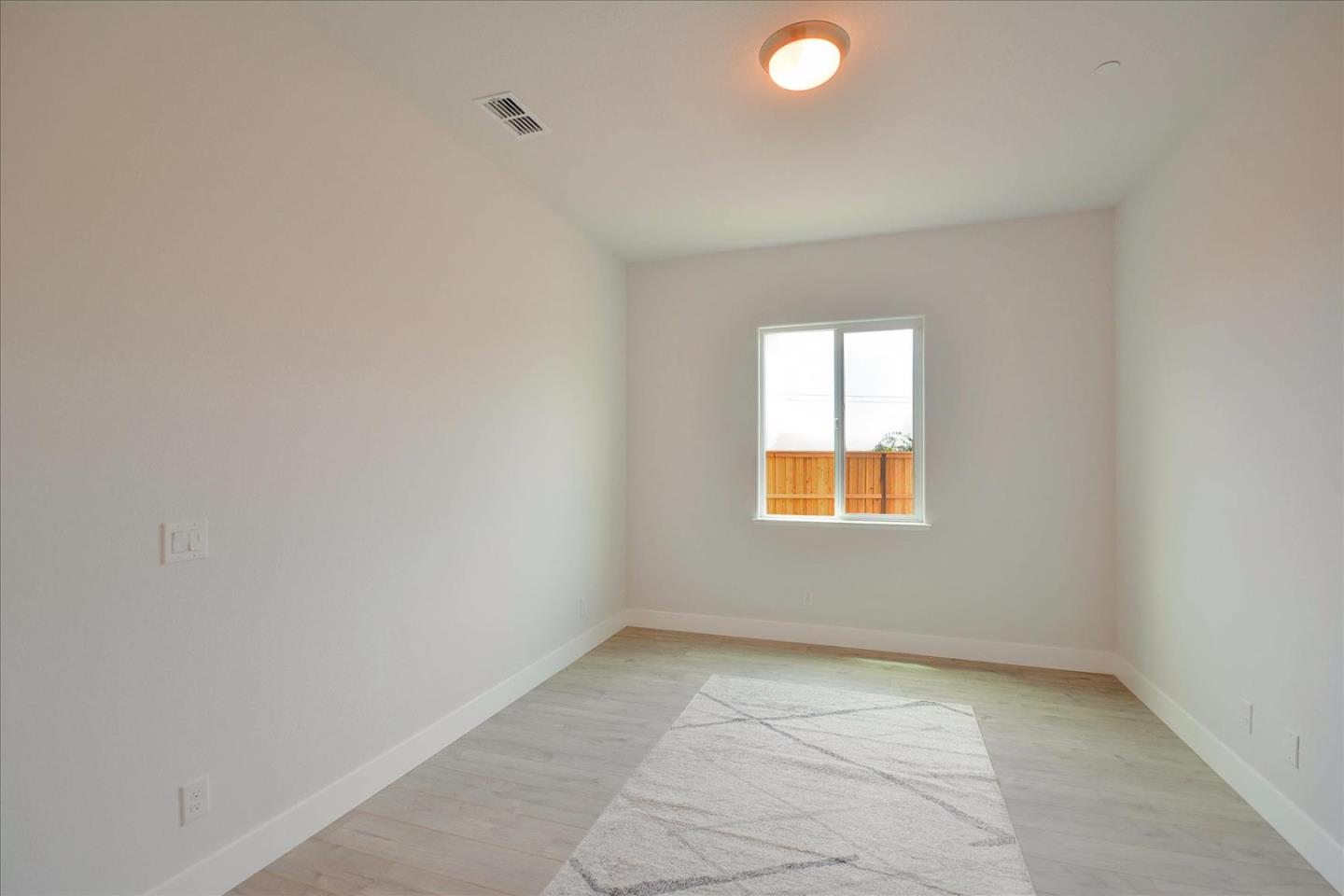 8157 Poppy Ridge Road Elk Grove, CA 95757 - Photo 17 of 42 an empty room with a window