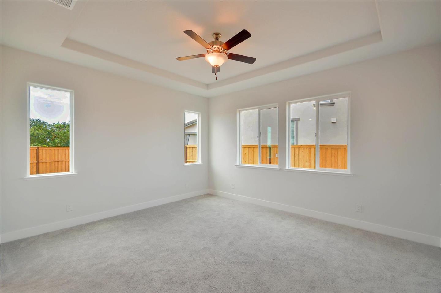 8157 Poppy Ridge Road Elk Grove, CA 95757 - Photo 20 of 42 an empty room with window and ceiling fan