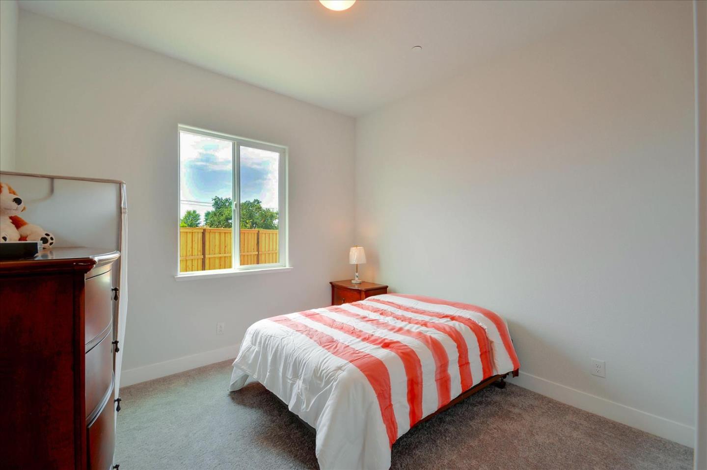 8157 Poppy Ridge Road Elk Grove, CA 95757 - Photo 23 of 42 a bed sitting in a bedroom next to a window