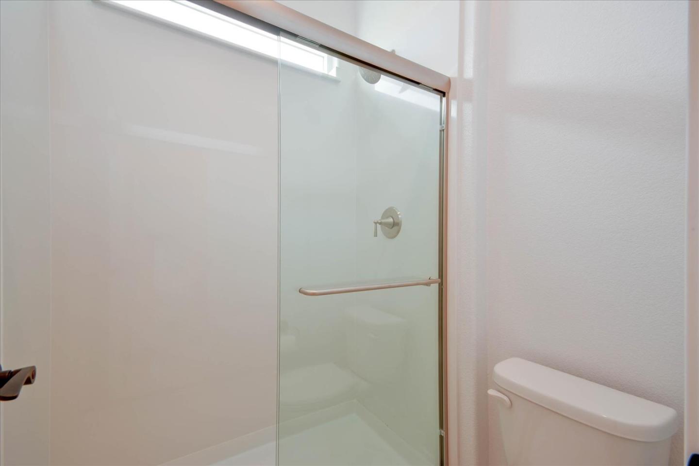 8157 Poppy Ridge Road Elk Grove, CA 95757 - Photo 26 of 42 a bathroom with a toilet and a shower