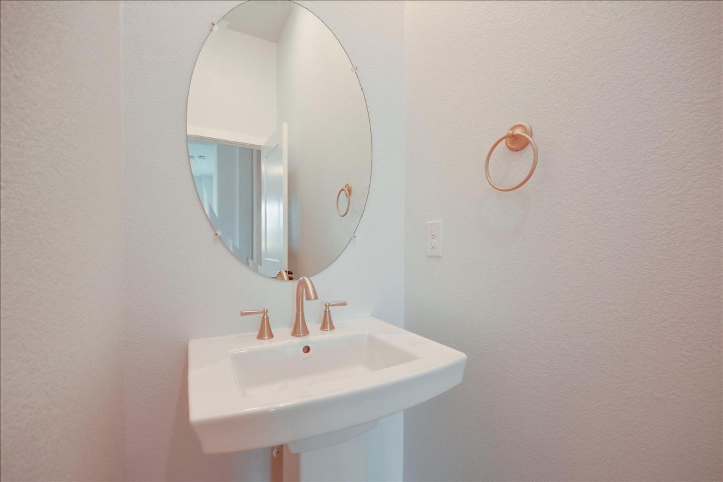 8157 Poppy Ridge Road Elk Grove, CA 95757 - Photo 29 of 42 a bathroom with a sink and a mirror