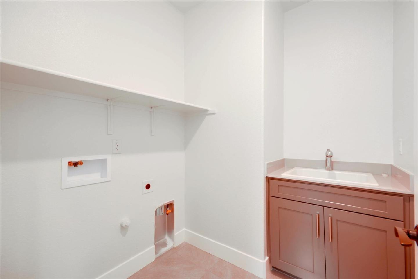 8157 Poppy Ridge Road Elk Grove, CA 95757 - Photo 33 of 42 a bathroom with a sink and vanity