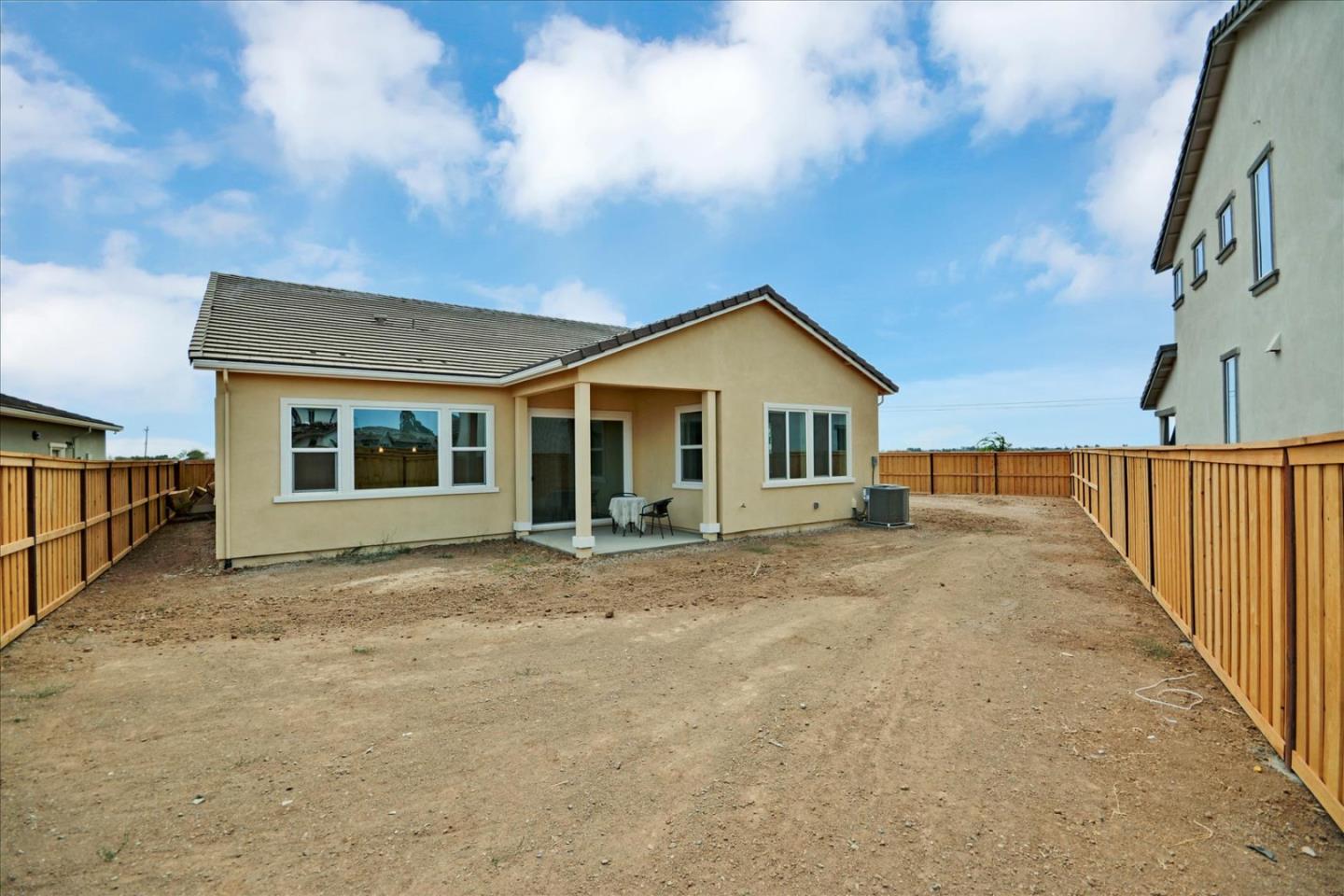 8157 Poppy Ridge Road Elk Grove, CA 95757 - Photo 36 of 42 a view of a house with wooden fence