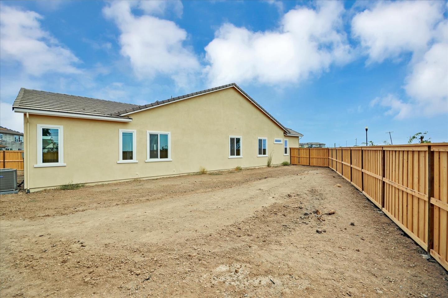 8157 Poppy Ridge Road Elk Grove, CA 95757 - Photo 40 of 42 a view of a house with a wooden fence