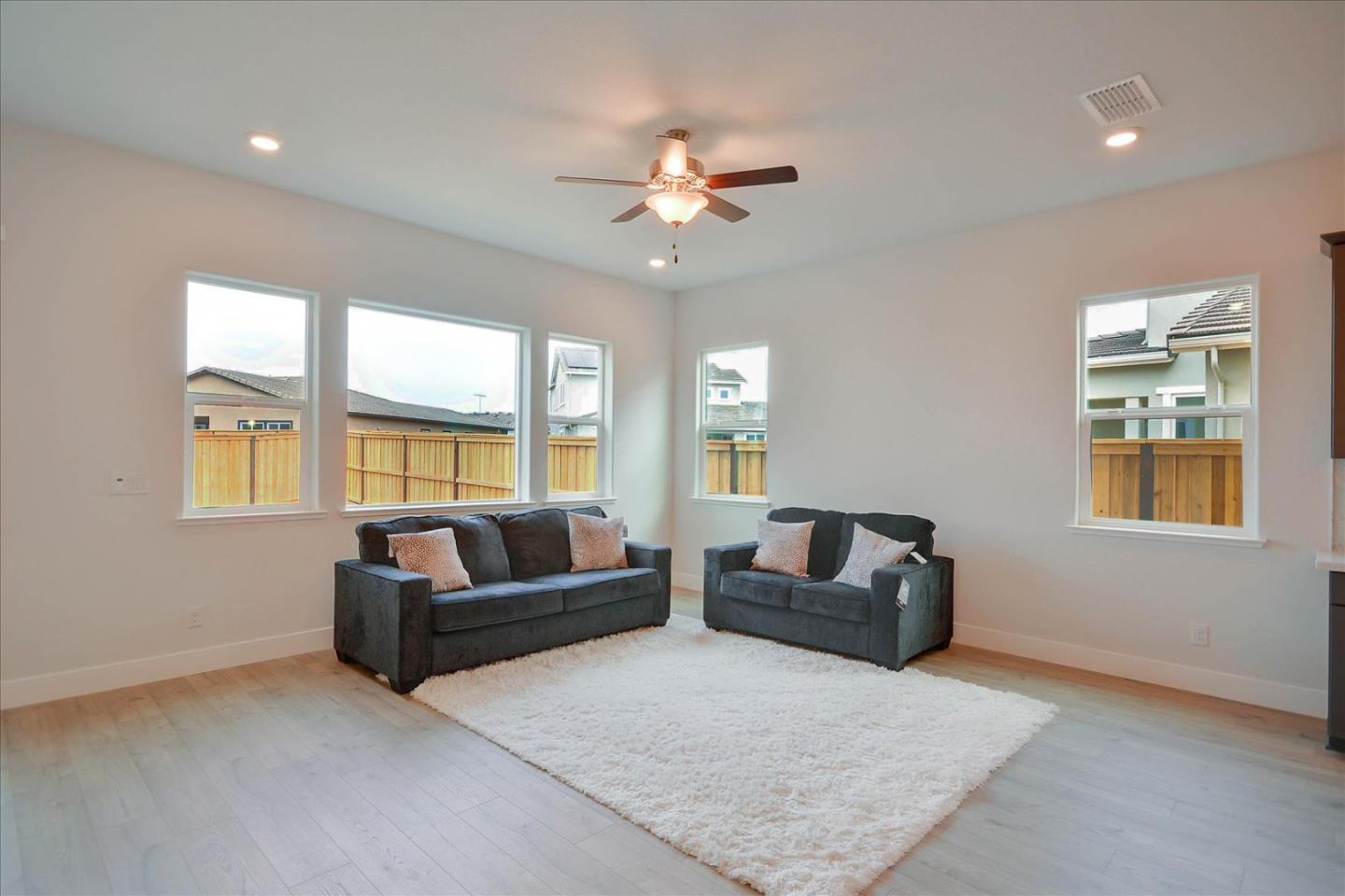 8157 Poppy Ridge Road Elk Grove, CA 95757 - Photo 4 of 42 a living room with furniture and a large window
