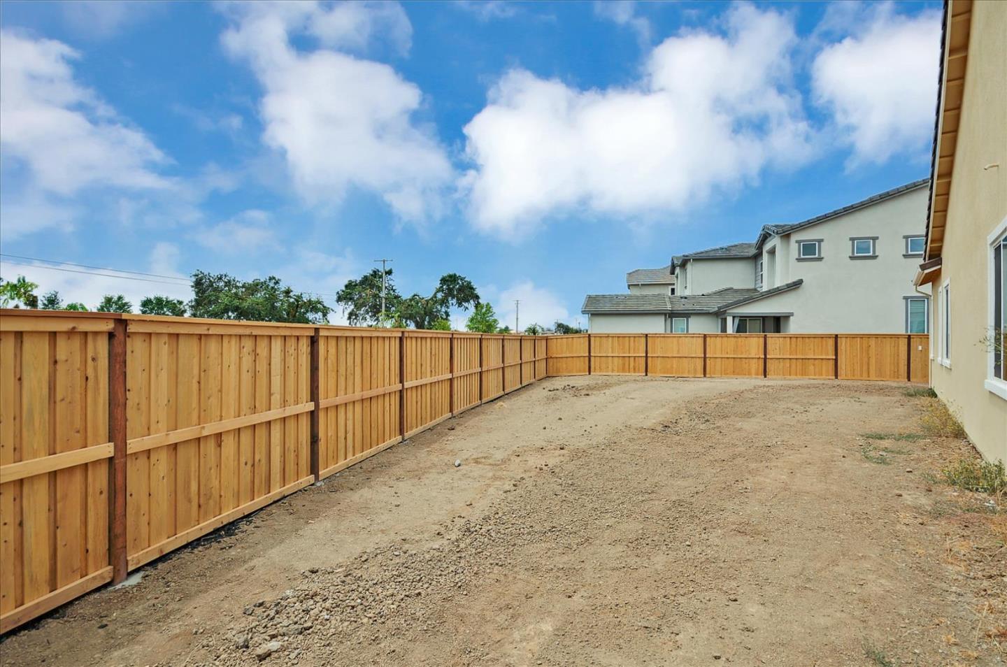 8157 Poppy Ridge Road Elk Grove, CA 95757 - Photo 42 of 42 a view of backyard with wooden fence