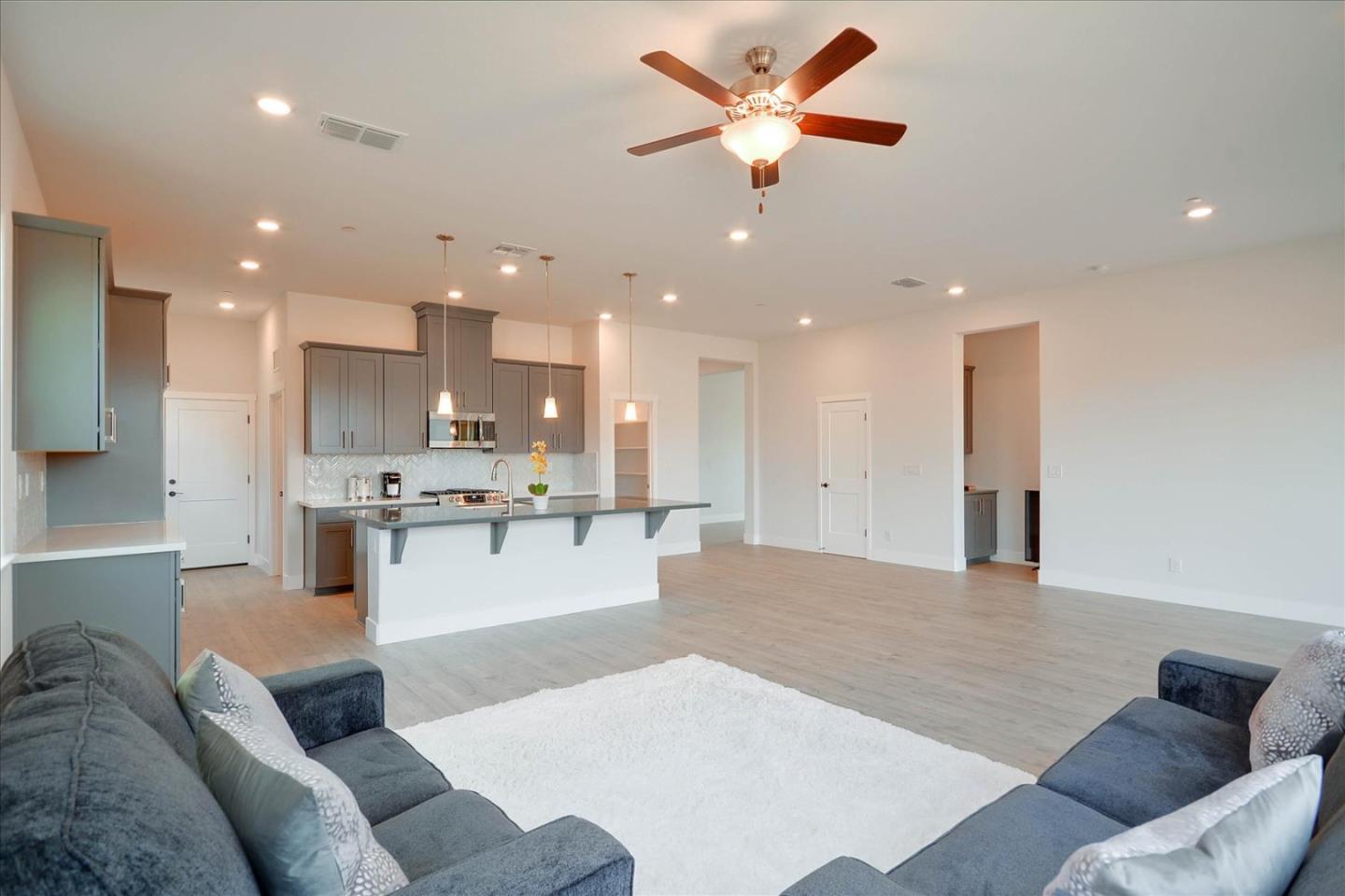 8157 Poppy Ridge Road Elk Grove, CA 95757 - Photo 5 of 42 a living room with furniture and kitchen view