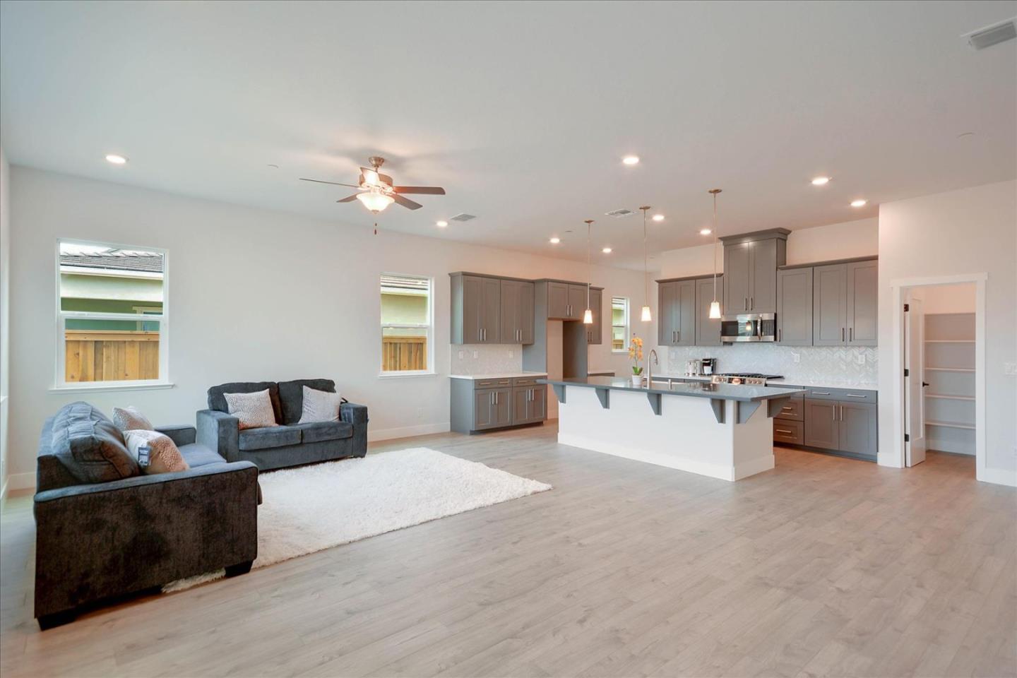 8157 Poppy Ridge Road Elk Grove, CA 95757 - Photo 6 of 42 a living room with furniture and kitchen view