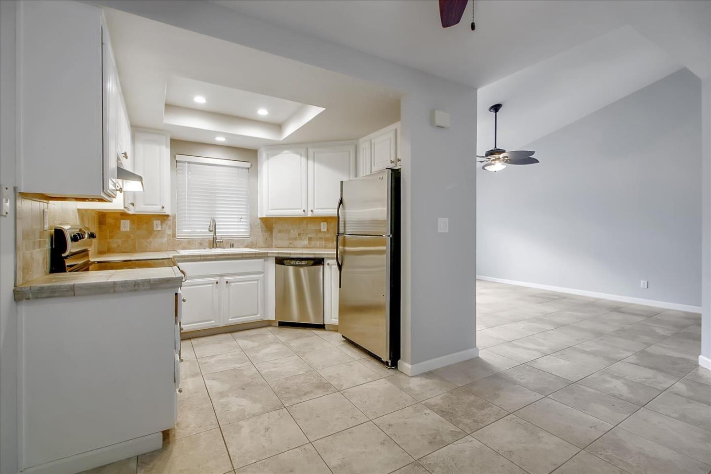 275 Shadow Dance Drive San Jose, CA 95110 - Photo 13 of 31 a kitchen with a refrigerator sink and cabinets
