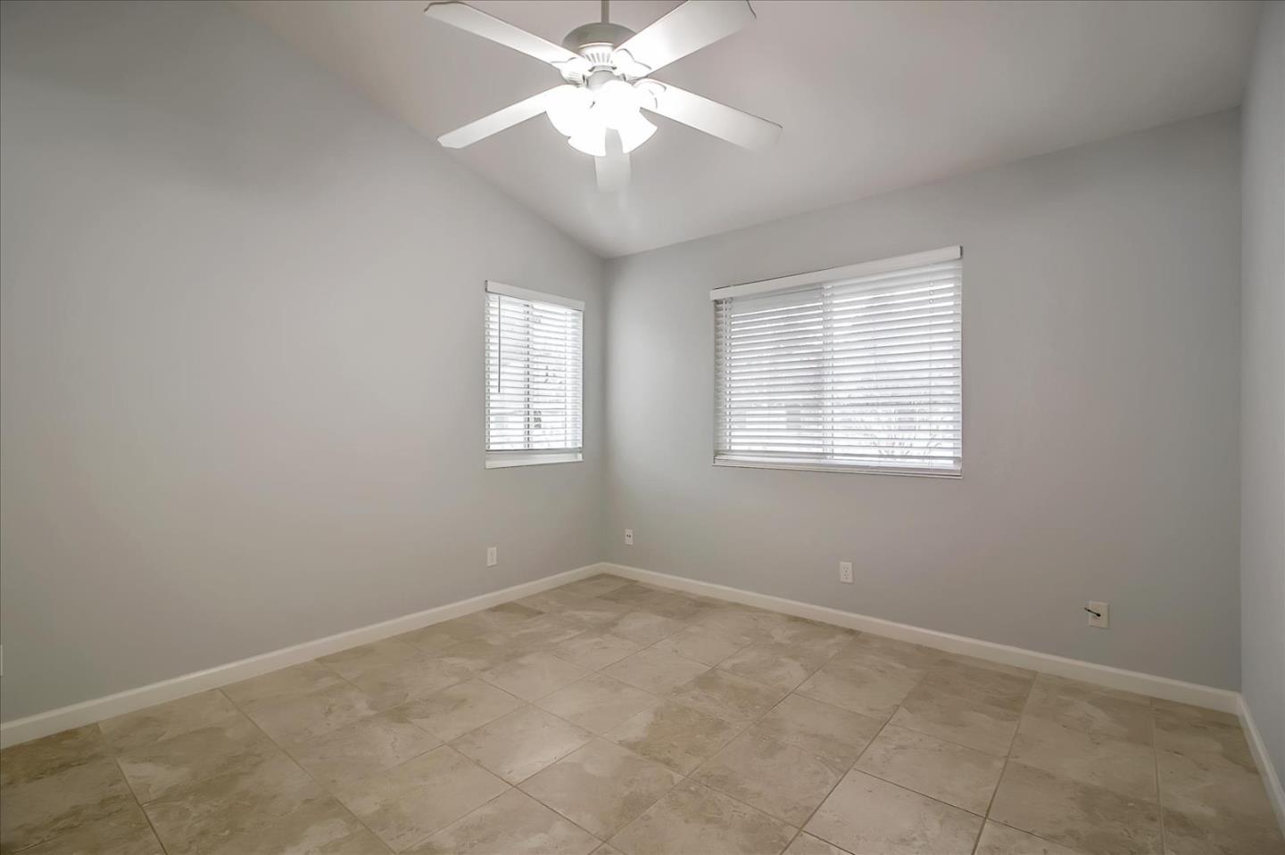 275 Shadow Dance Drive San Jose, CA 95110 - Photo 16 of 31 an empty room with windows and fan
