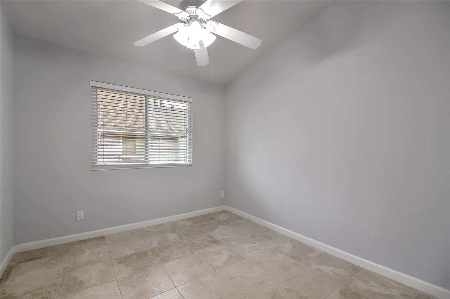275 Shadow Dance Drive San Jose, CA 95110 - Photo 18 of 31 wooden floor in an empty room with a window