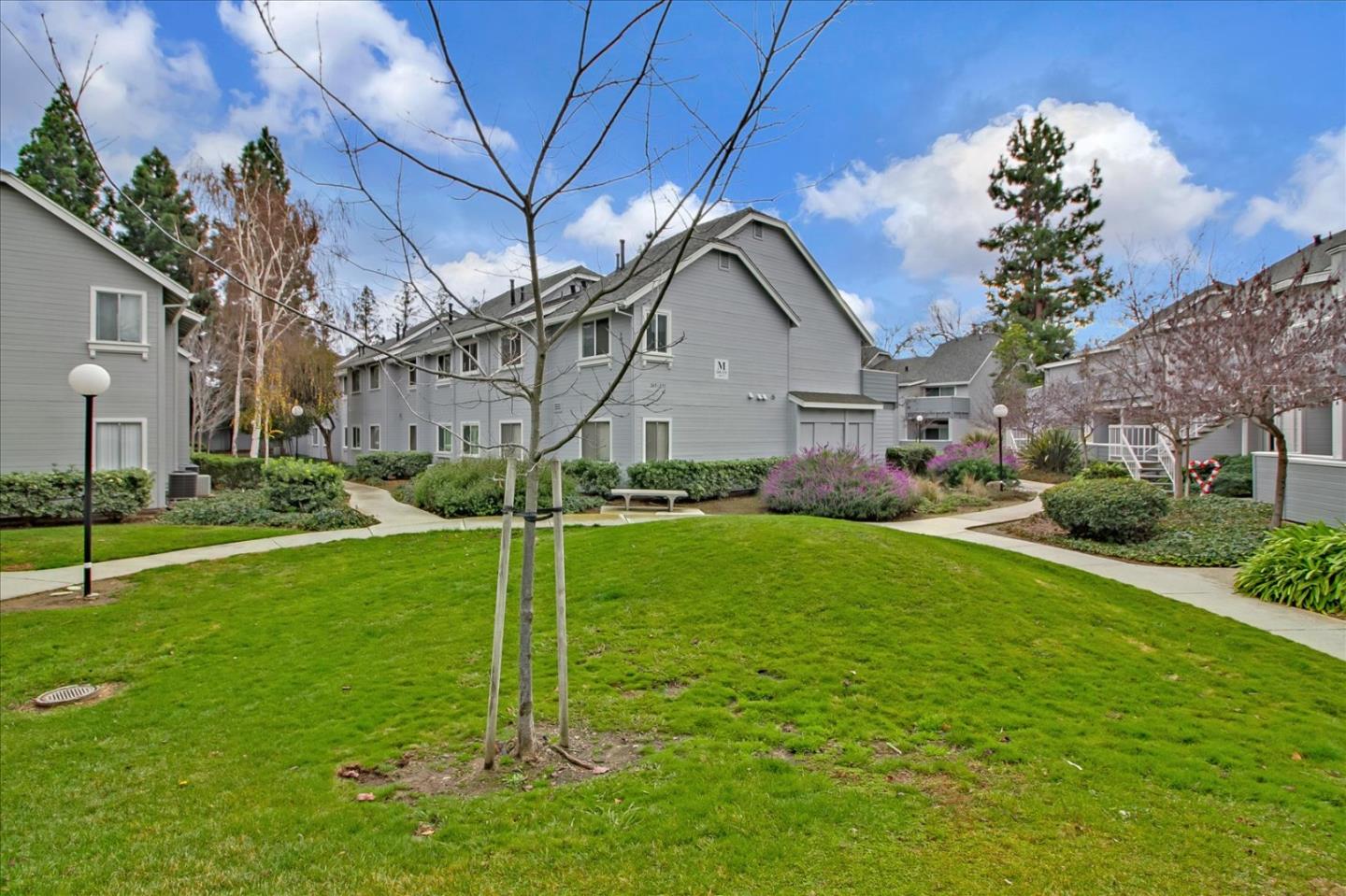275 Shadow Dance Drive San Jose, CA 95110 - Photo 27 of 31 a house view with a play ground and a large tree