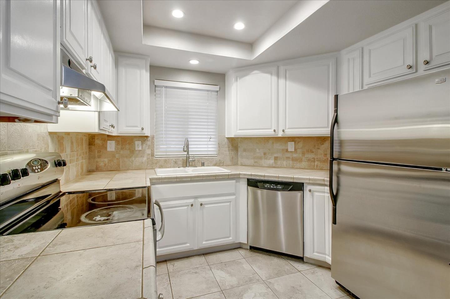 275 Shadow Dance Drive San Jose, CA 95110 - Photo 10 of 31 a kitchen with a sink appliances and cabinets
