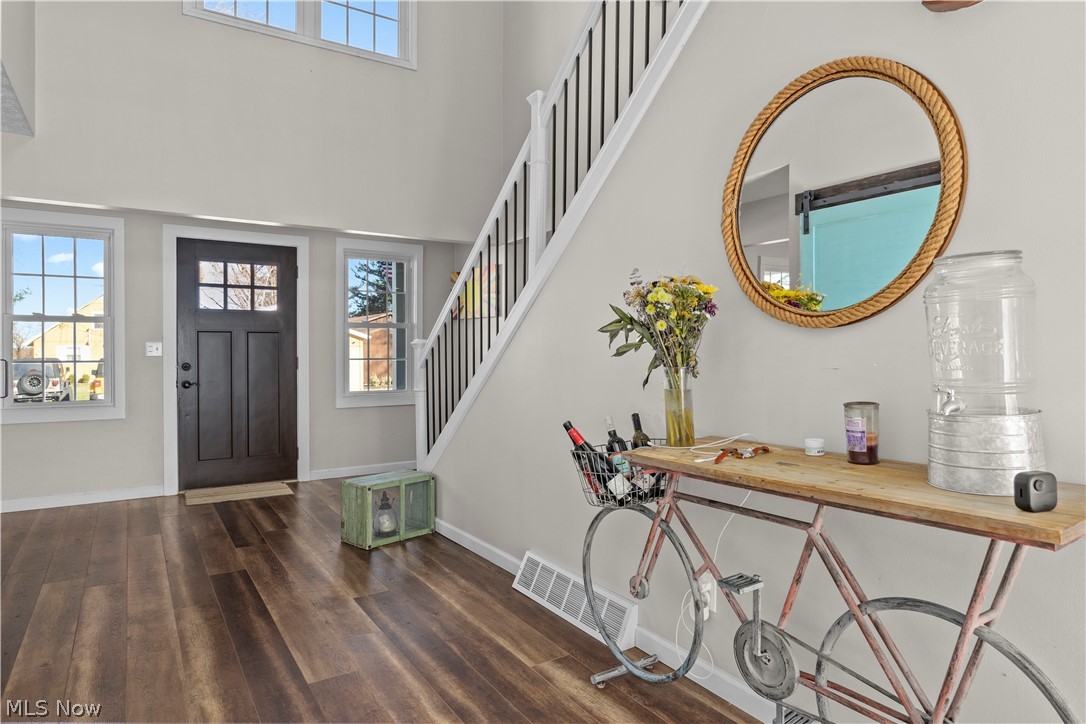 44 Center Road Vermilion, OH 44089 - Photo 4 of 38 Foyer featuring a towering ceiling and dark hardwood / wood-style floors