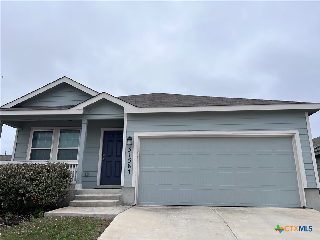 a front view of a house with garage