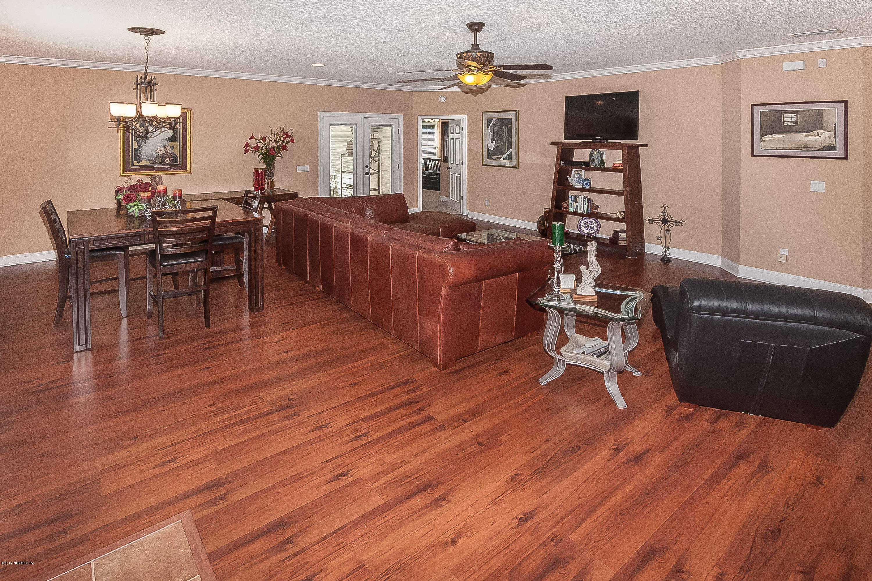 7713 Palmo Fish Camp Road St. Augustine, FL 32092 - Photo 8 of 35 a living room with furniture and wooden floor