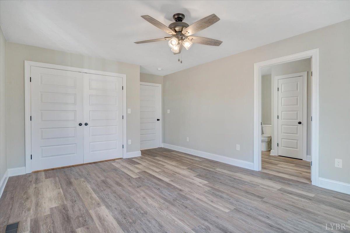 5934 Joppa Mill Road Moneta, VA 24121 - Photo 16 of 45 a view of an empty room with wooden floor