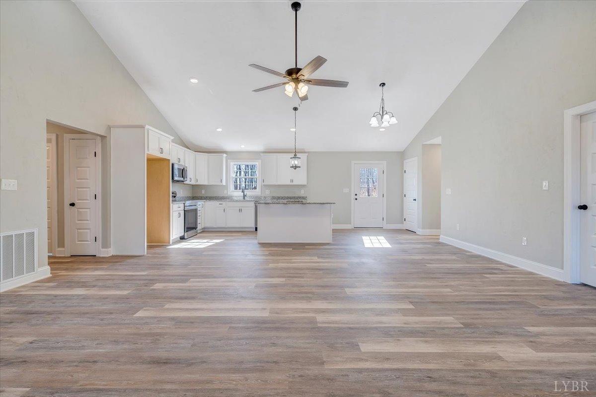 5934 Joppa Mill Road Moneta, VA 24121 - Photo 2 of 45 a view of a kitchen with a dishwasher kitchen stove a refrigerator cabinets and wooden floor