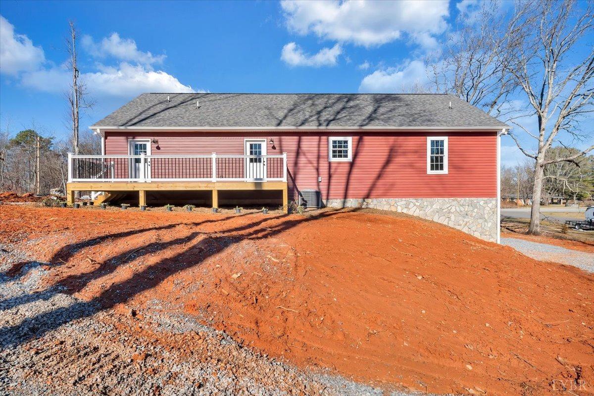 5934 Joppa Mill Road Moneta, VA 24121 - Photo 34 of 45 a front view of a house with a yard outdoor seating and garage