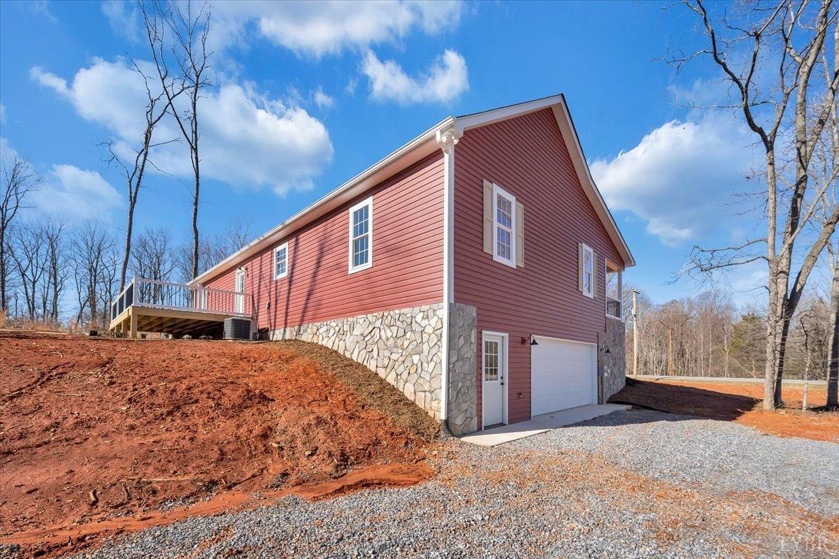 5934 Joppa Mill Road Moneta, VA 24121 - Photo 37 of 45 a backyard of a house with large trees and outdoor space