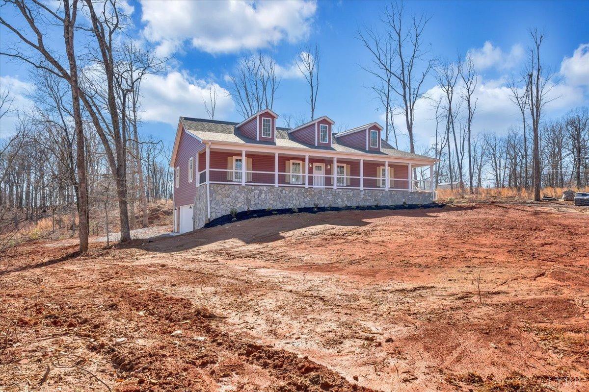 5934 Joppa Mill Road Moneta, VA 24121 - Photo 45 of 45 a front view of a house with a yard covered with snow and trees