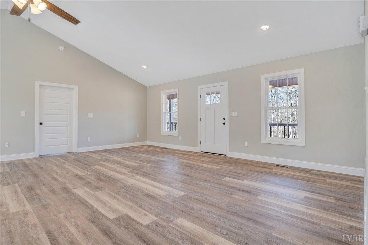 5934 Joppa Mill Road Moneta, VA 24121 - Photo 5 of 45 a view of an empty room with wooden floor and window