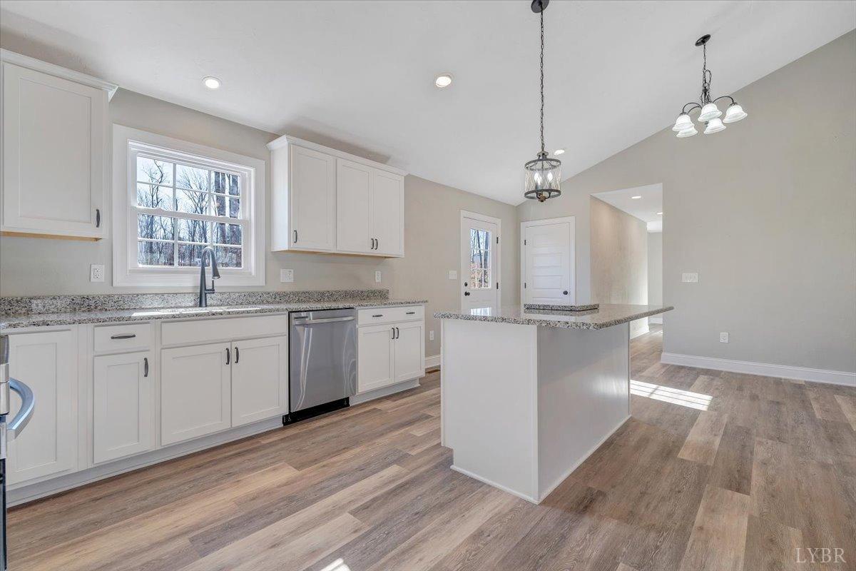 5934 Joppa Mill Road Moneta, VA 24121 - Photo 8 of 45 a kitchen with kitchen island white cabinets and white appliances