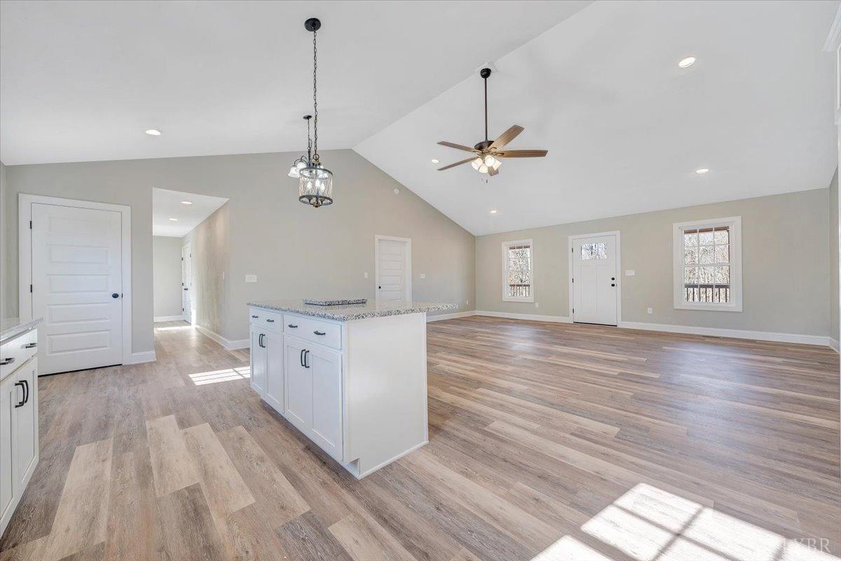 5934 Joppa Mill Road Moneta, VA 24121 - Photo 9 of 45 a view of a kitchen with center island wooden floor and window