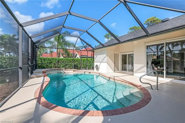 a view of a swimming pool with a patio