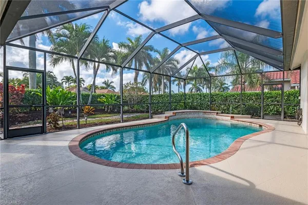a view of a swimming pool with a patio