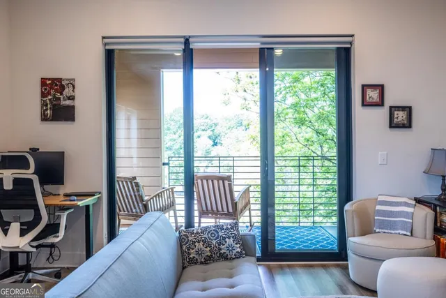 a living room with furniture and a window