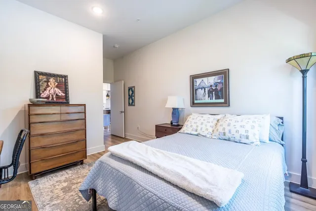 a bedroom with a bed and a dresser