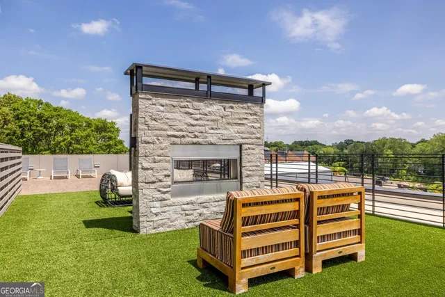 a view of a deck with a big yard