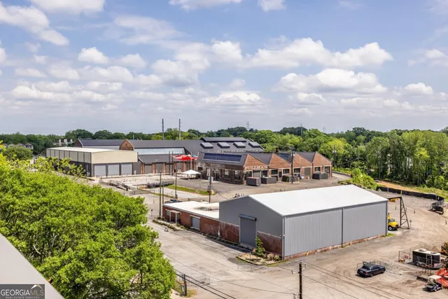 a view of a house with roof deck and sitting area