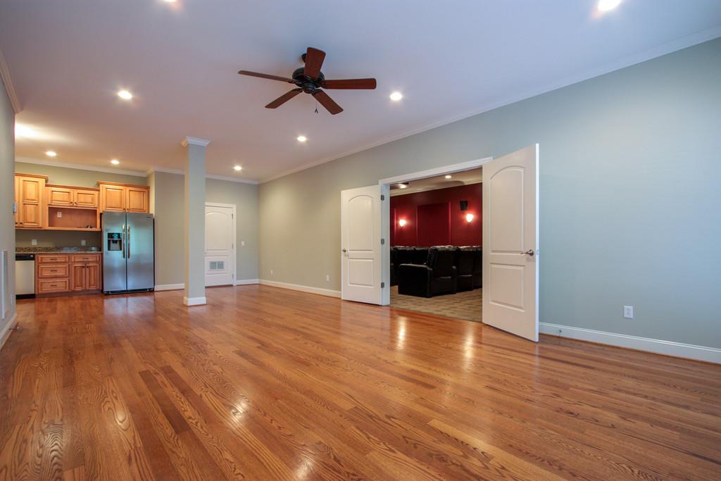 7127 Old Franklin Road Fairview, TN 37062 - Photo 21 of 30 a view of empty room with wooden floor and fan