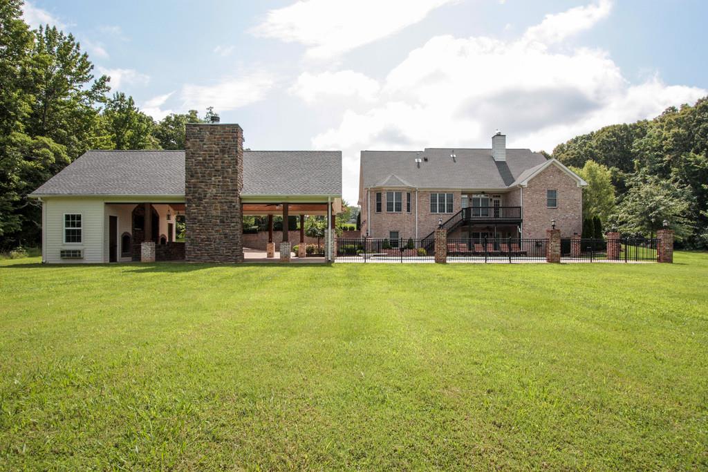 7127 Old Franklin Road Fairview, TN 37062 - Photo 23 of 30 a front view of a house with garden