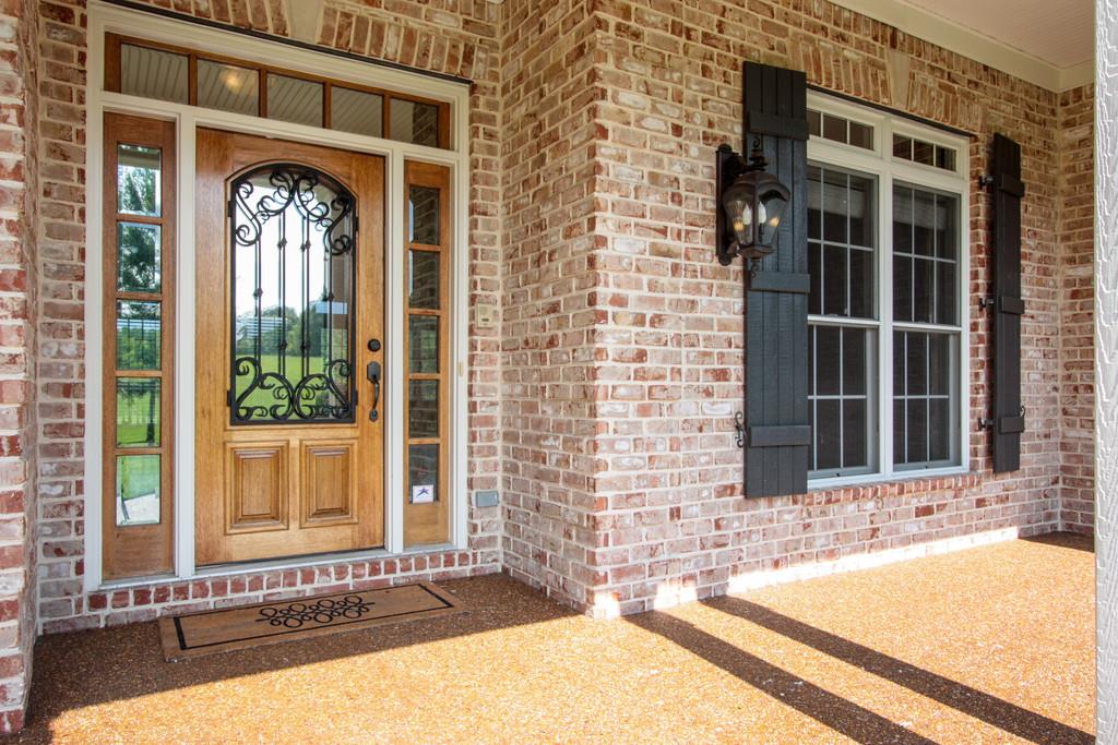 7127 Old Franklin Road Fairview, TN 37062 - Photo 3 of 30 a front view of a house with a yard