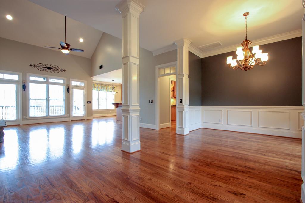 7127 Old Franklin Road Fairview, TN 37062 - Photo 6 of 30 a view of a room with wooden floor and chandelier