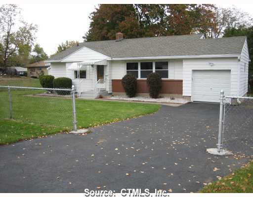 14 Chestnut Road Newington, CT 06111 - Photo 1 of 1 a front view of a house with a yard and garage